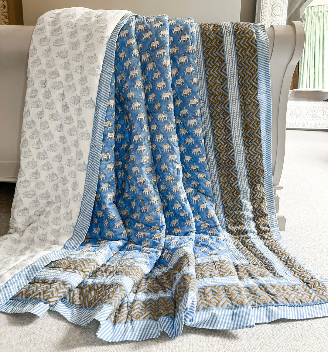 Handmade king size block print blue quilt from India. Blue elephant quilt with chevron border and blue pinstripe border. Reversible. Machine washable. Bombaby.